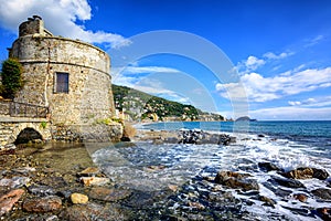 Historical Saracen tower in Alassio, resort town on Riviera, Italy photo