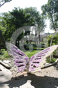 Taksim Gezi Park is a city park located in Taksim Square, butterfly flower sculpture photo