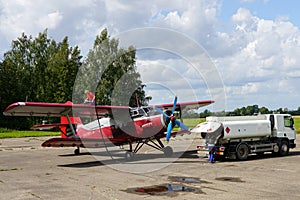 Historical single engine airplane Antonov AN2, refueling