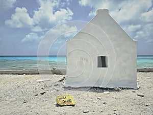 Historical Slave Hut by Turquoise Caribbean Waters