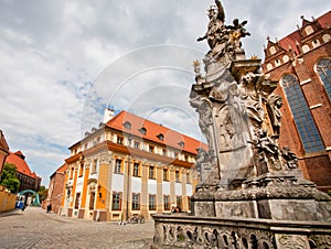 Historical statue with angels near the churches of the old polish city