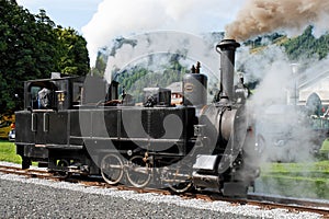 Historical steam engine on tracks