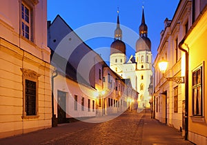 Historical street in Trnava with Saint Nicolas chu