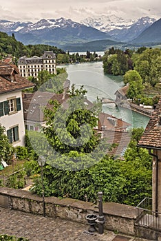 Historical Thun city and lake Thun with snow covered Bernese Highlands swiss Alps mountains in background, Canton Bern