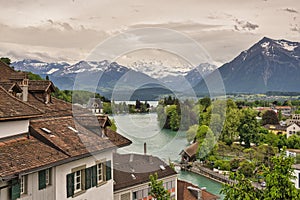 Historical Thun city and lake Thun with snow covered Bernese Highlands swiss Alps mountains in background, Canton Bern