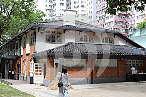 A historical traditional Chinese building with red bricks and roof tiles constructed in 1908 in Hong Kong