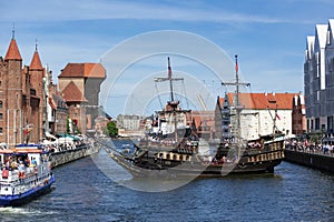 Historical vesse Lew at Stara Motlawa river, Gdansk offering tours for tourists turning around