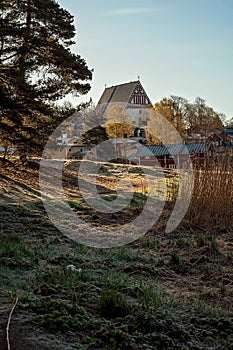 Historical village from the medieval times, pictured from the woods or forest. The Porvoo old town and the famous cathedral, many