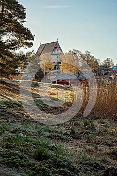 Historical village from the medieval times, pictured from the woods or forest. The Porvoo old town and the famous cathedral, many