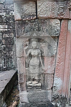 Vishnu, shiva, hindu god symbol, face in ancient temple ruins of angkor wat, cambodia, yoga class