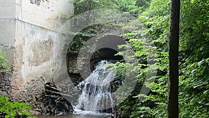 Historical watermill ruins and little waterfall