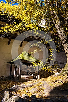 Historical well under tree in old castle in Banska Stiavnica, Slovakia, UNESCO