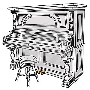 The historical white pianino with a chair