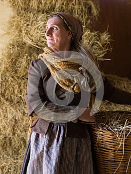 Historical woman with hay basket