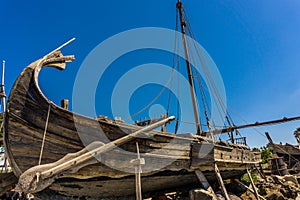 Historical wooden shipwreck reconstruction on land, Urla, Izmir, Turkey. Ancient Greek culture, kyklades ship