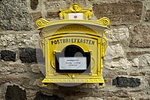 historical yellow mailbox in Germany