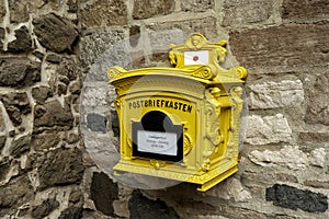 historical yellow mailbox in Germany