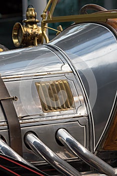 History of the automobile. Antique car in close-up. Vintage chrome detail