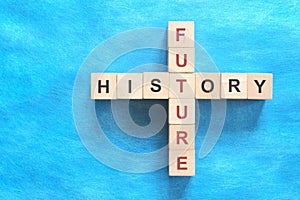History and future relationship and interconnection concept. Crossword puzzle flat lay photo