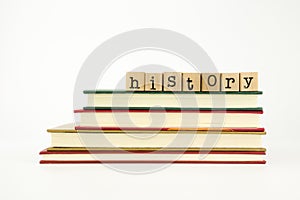 History word on wood stamps and books