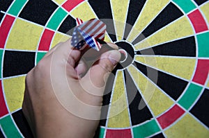 Hit the target while playing darts.