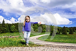 Hitch-hiking by cute little girl