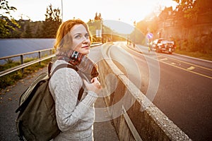 Hitch-hiking girl on a road