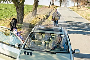 Hitch-hiking parked car girl friends offer lift