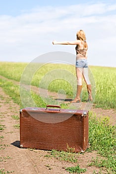 Hitchhiker with a suitcase