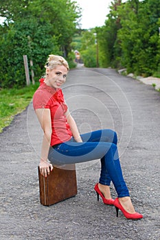 Hitchhiker with suitcase photo