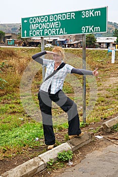 Hitchhiking blonde girl in Africa