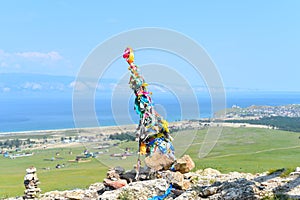 Hitching post with ribbons of shamanism religion in Khuzhir, island Olkhon.