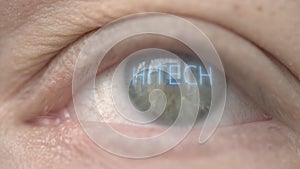 HITECH word on human eye. Modern technology related close-up shot