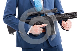 Hitman hands holding military weapon