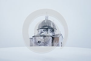 Hitoric chapel on Mount Radhost in Pustevny in Beskydy mountains in the east of the Czech Republic. Minimalism. The chapel rises