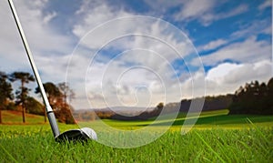 Hitting golf ball on fairway photo