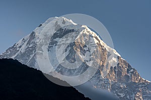 Hiunchuli snowcapped mountain summit against blue sky in Annapurna Base Camp trekking