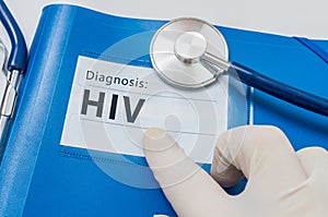 HIV diagnosis on blue folder with stethoscope