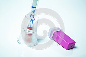 HIV self-test and its lancing device on white background