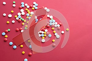 HIV symbol and pills on ted background , red background