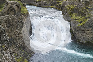Helper waterfall HjÃÂ¡lparfoss in a FossÃÂ¡ in Iceland photo