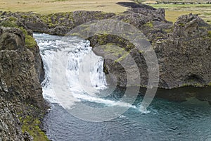 Helper waterfall HjÃÂ¡lparfoss in a FossÃÂ¡ in Iceland. photo