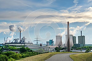 HKM, steelworks Krupp Mannesmann and power plant towers, heavy industry pollution using fossil energy in Duisburg, Germany, blue