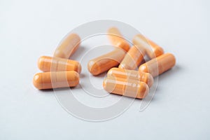 HMB ÃÂ²-Hydroxy ÃÂ²-methylbutyric acid capsules. Bodybuilding food supplements on bright paper background. photo