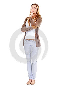 Hmmm...what should we do with this copyspace. A young woman in casual wear looking thoughtful - isolated.