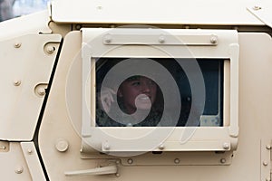 HMMWV Military vehicle with soldier looking out the window