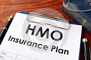 HMO Insurance Plan on a table.