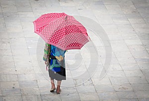 hmong girl with big red umbrella in Sa Pa, Lao Cai, Vietnam