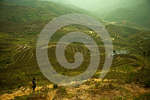 Hmong villager walk at Curve Dirt road with and paddle rice fiel