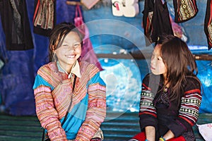 Hmong woman people are colorful costume trading of agricultural products at the LAOCAI